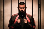 An inmate performs during a play at a public theatre in Lima