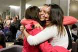 Garcia (left) celebrates with fellow UW students Jessica Oscoy and Tania Santiago as Obama's reelection is announced at a UW watch party. (Photo by Joshua Bessex/The University of Washington Daily)