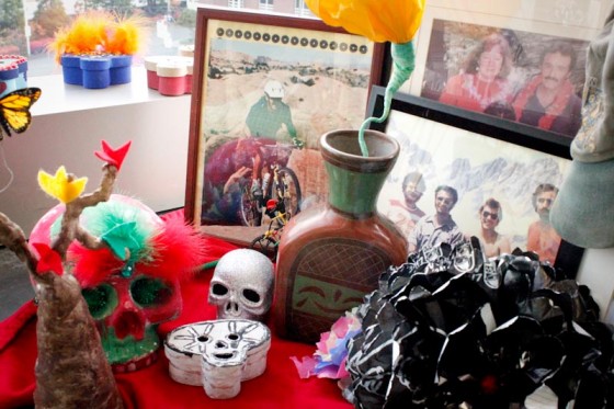An altar created by the Enrique family honoring a family member. The photographs show important moments he spent with his family. The skulls and the leaves of the tree make people remember how his personality is still alive. (Photo by Liliana Caracoza)