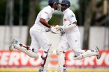 Despite appearances, Cricket doesn't involve synchronized dance routines. It does have players running back and forth between two different wickets, rather than four bases, as in baseball. (Photo from REUTERS/Dinuka Liyanawatte)