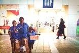 Kenyan children play with a donated soccer ball in part of the World Vision display at Northgate Mall. (Photo by Alex Stonehill)