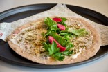 Manou'she jibneh wi zaatar aka pita with cheese, spices and mint. (Photo courtesy Mamnoon)