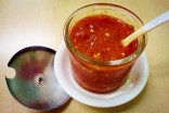 The much-adored Green Village homemade pepper sauce. Made fresh in house, it’s a favorite among the restaurant’s regular guests. (Photo by Lisa Strube-Kilgore)