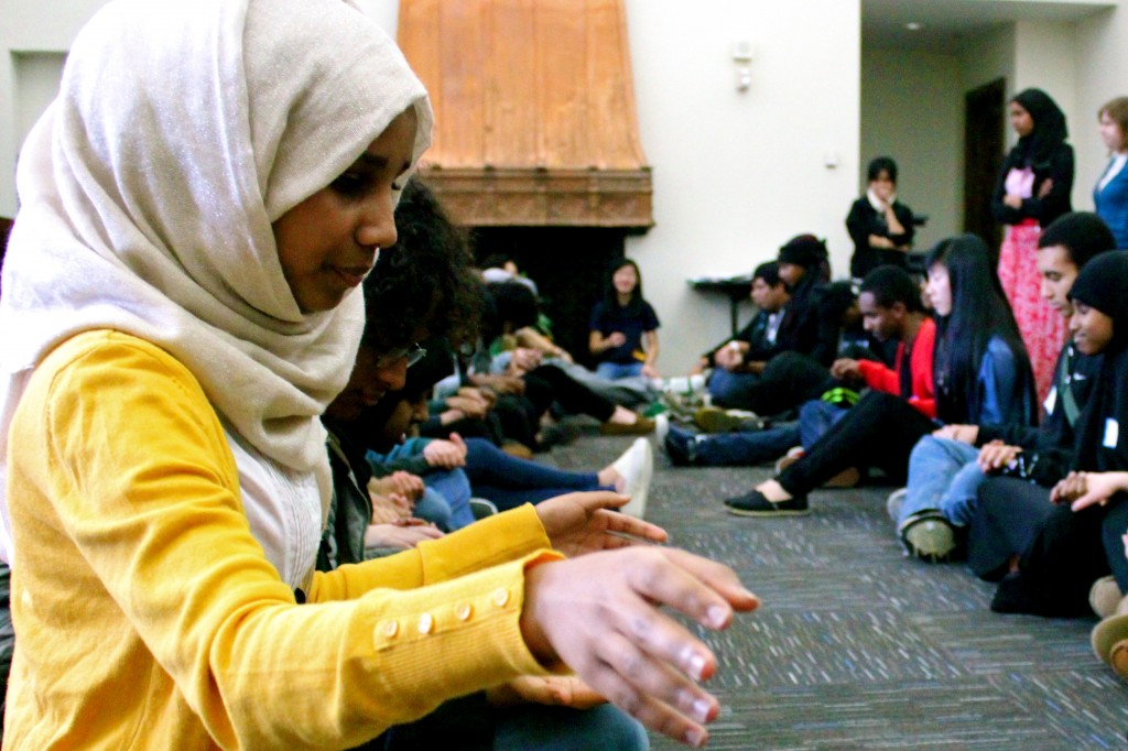 Youth participate in a warm-up game during a OneWorld Now! global leadership workshop. 