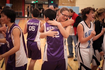 Chief Sealth Sophmore Jessie Dirks and Nankai Sophmore Zhao Yi embrace after the game. (Photo by Alex Stonehill)