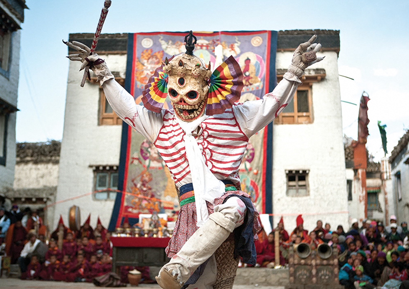 A costumed monk performs a dance at the Tiji festival in the town square of Lo Manthang. Many in the kingdom fear ancient traditions will be lost as modernization takes hold. (Photo by Taylor Weidman)