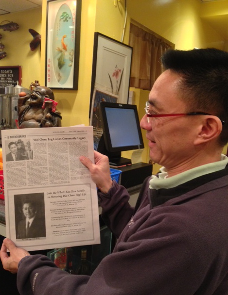 Richard Chang points out Eng’s picture in the newspaper (upper left). Photo by Jessica Kamzan