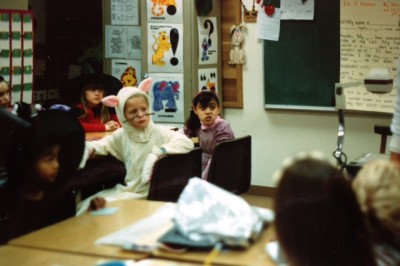 Chaunty Thook (far left) and Roxana (center) at a Halloween celebration in their 3rd grade classroom at Helen Keller elementary.