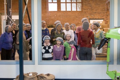 Kids press their face against the glass during a tour at Theo Chocolate in Fremont. (Photo by Sandi Heinrich)