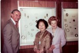 During the second exhibition of the Young family’s robes and jades in 1981, Mary Young (center) poses next to these treasures with Jon Kowalek, former Tacoma Art Museum director, and Pearlie Baskin. (Photo courtesy of the Young family)