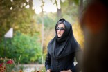 An Iranian woman poses for a photo during a visit to the botanical garden in Shiraz. (Photo by Paul Keller)