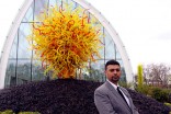 Muthanna Al-Nidawi, who recently emigrated from Iraq and is now a security guard at Chihuly Garden and Glass at Seattle Center. (Photo by Alan Berner/The Seattle Times)