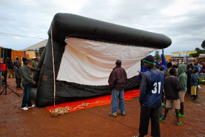The Hillywood screen inflates at a rural screening site in Rwanda. (Photo courtesy Leah Warshawski)