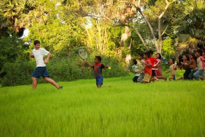Quincy Briscoe plays with Cambodian children during his stay in Pongro Village in 2008. (Photo by Christopher Briscoe)