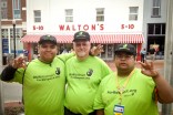 Three of Walmart's 2.2 million employees gather in protest at the company's first location in Bentonville, Arkansas. (Photo via How To Change Walmart Tumblr)