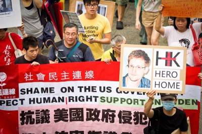 A June 15th rally in support of leaker Edward Snowden, held in Hong Kong, where he was taking refuge at the time. He's currently in Russia, seeking permanent asylum in Cuba. (Photo from Flickr by See Ming Lee)