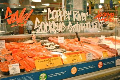 A Boston company is awaiting FDA approval of genetically modified Atlantic salmon, which used a growth hormone from the Chinook salmon to increase the speed of the fish's growth. Whole Foods (pictured here) has already committed to never offering the GM salmon, and the Seattle City Council passed a resolution opposing the salmon. (Photo by Rebecca Randall)