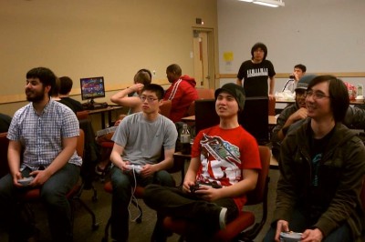 Members of SRKUW including Paul Ostermann (far right) play fighting games competitively every Friday night. (Photo courtesy SRKUW)
