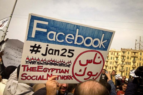 Egyptian protesters in Tahrir Square in 2011 celebrate Facebook's contribution to the Arab Spring. (Photo by Essam Sharaf via Flickr)