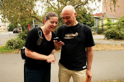 Stephanie Weber and her husband, Pier Paolo Perrone, of Frankfurt, Germany, look for clues to find a geocache in Seattle's Fremont neighborhood on Wednesday. (Photo by Erika Schultz / The Seattle Times)
