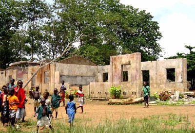 A school in Koindu damaged by RUF rebel forces during the Sierra Leone Civil War. (Photo from USAID via Wikipedia)