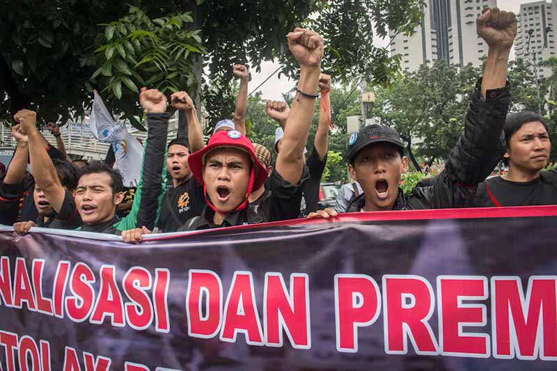Unionized metal workers hold a demonstration over pay in Jakarta last January. (Photo by Branden Eastwood)