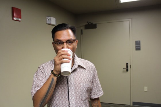 Guest Judge Prometheus Brown (aka Geo Quibuyen) sips coffee during intermission. 