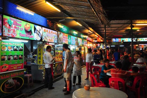 Food hawker stalls in Pulau Penang, Malaysia, where customers by food from individual stalls and then eat in a communal dining area, or at home. (Photo by Davidlohr Bueso via Flickr)
