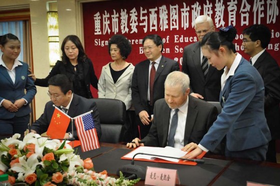Mayor McGinn signing a memorandum of understanding with counterpart in Seattle sister city Chongqing, China. (Photo courtesy McGinn Campaign)