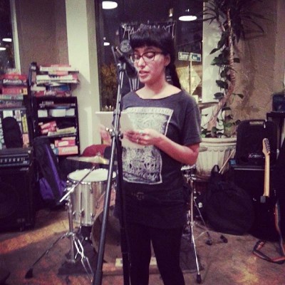 Nyky Gomez reading in Seattle at Black Coffee Co-op last week (Photo via <a href="http://instagram.com/poczineproject">POC Zine Project </a>)
