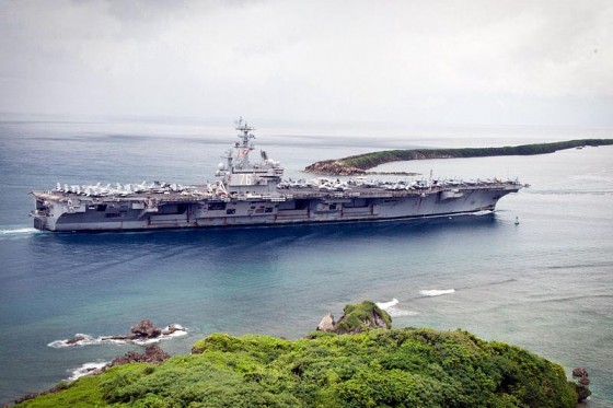 The aircraft carrier USS Ronald Reagan enters Apra Harbor in Guam. (Photo by U.S. Navy/Peter Lewis)