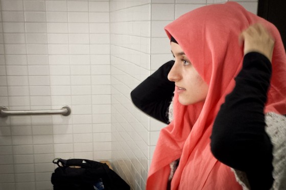 Meva Beganovic,who started wearing hijab after moving to Seattle from Eastern Washington, prepares to pray at the Muslim prayer room in the UW HUB. (Photo by Annie Wilson)