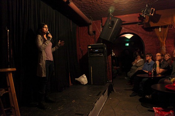 Comedian Aisha Farhoud performs at the Comedy Womb, a female centered open mic at The Rendezvous in Belltown. (Photo by Sara McCaslin)