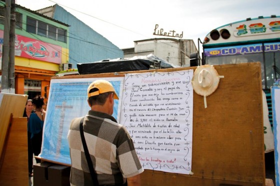 A man at the annual Encuentro de Victimas (Meeting of Victims) reads a poem written by the father of a child killed by the military in Morazán province. (Photo by Alex Montalvo)