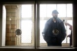 Many Uch, who was detained in the INS building before it closed in the late 90's, gives one of the interviews used in "left:behind". (Photo by Alex Stonehill)