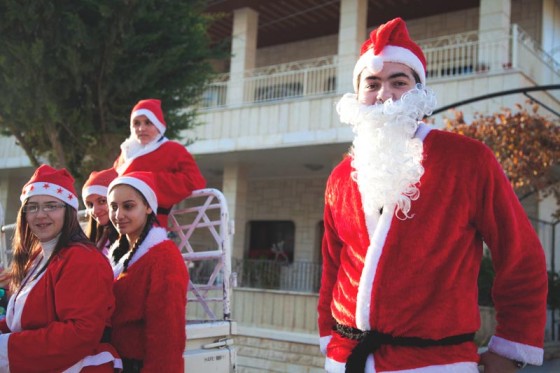 Young Santas ride around Maaloula, Syria in a pickup truck during Christmas of 2010. (Photo by Alex Stonehill)