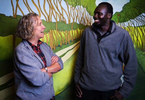 Sarah Zerkel, a parent with Lutheran Community Services' foster care for international kids program, talks with Biel Yuol,  who was her and husband Tom's first foster child. (Photo by Lindsey Wasson / The Seattle Times)