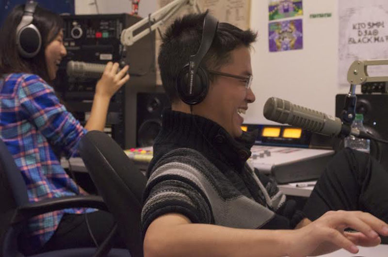 Danxiaomeng Huang (left) and Yiqin Weng (right) share a laugh during HUA-Voice Radio’s first official live broadcast at UW’s Rainy Dawg Radio studio on Friday, Jan. 17, 2014. (Photo by Shirley Qiu)