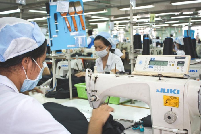 Free trade agreements eliminate domestic manufacturing jobs, while driving down wages and labor conditions in foreign factories, like this one in Vietnam. (Photo by A. Dow / ILO)