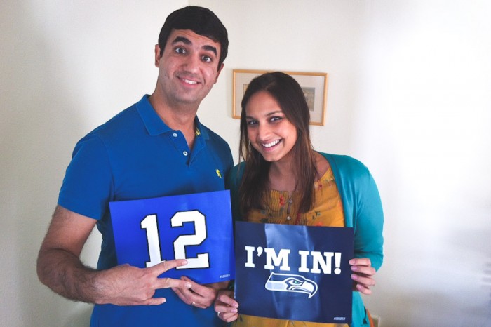The author and her husband show off their Seahawks pride. (Photo by Alex Stonehill)