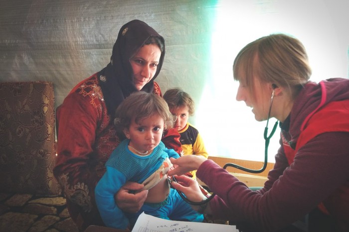 Volunteers from Humedica, a German NGO, provide medical care for young refugees in Lebanon. (Photo by Karin Huster)