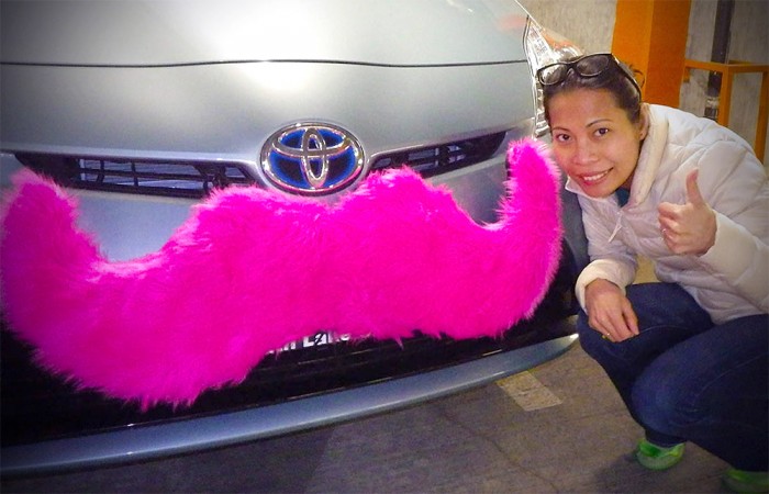 The author, Sanda Htyte, with her mustached-Lyft car. (Photo courtesy of Sanda Htyte)