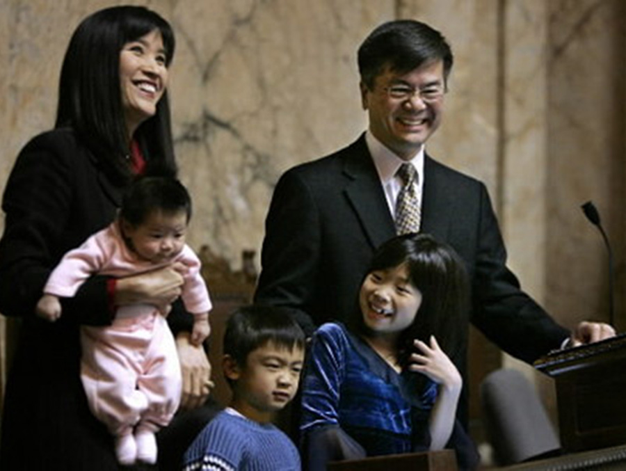 Gary Locke, near the end of his second term as Washington’s governor, stands with his family during his final State of the State address on Jan. 11, 2005. To this day, Locke is the only Chinese-American official that has served as governor of a U.S. state. (Photo by Elaine Thompson)
