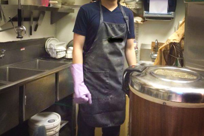 An international student who asked for his identity to be concealed works illegally as a dishwasher at a restaurant in Edmonds. (Photo by Yue Ching Yeung)