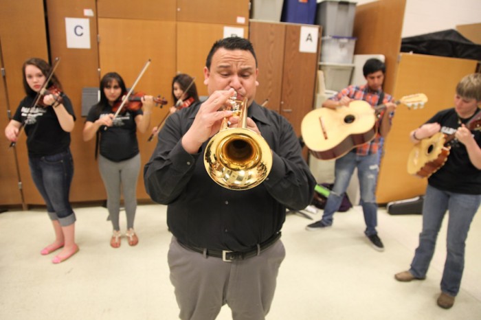 Ramon Rivera learned Mariachi music from his parents growing near Los Angeles and was recruited to run the Mariachi Huenachi program at Wenatchee High School 8 years ago. (Photo by Alex Stonehill)