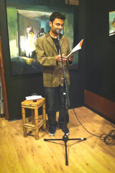 Ahmed reading unpublished works at the APRIL Festival in Seattle. (Photo courtesy Frances Dinger)