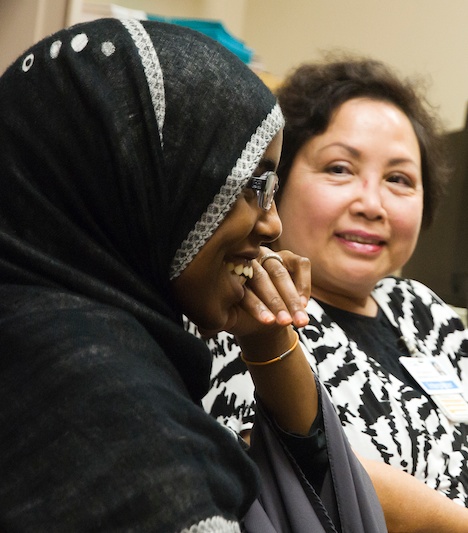 Two interpreters at the International Medicine Clinic at Harborview Medical Center. Many interpreters employed there also work as cultural mediators, working with doctors and patients to contextualize medical conditions like FGC. (Photo courtesy Dr. Carey Jackson)