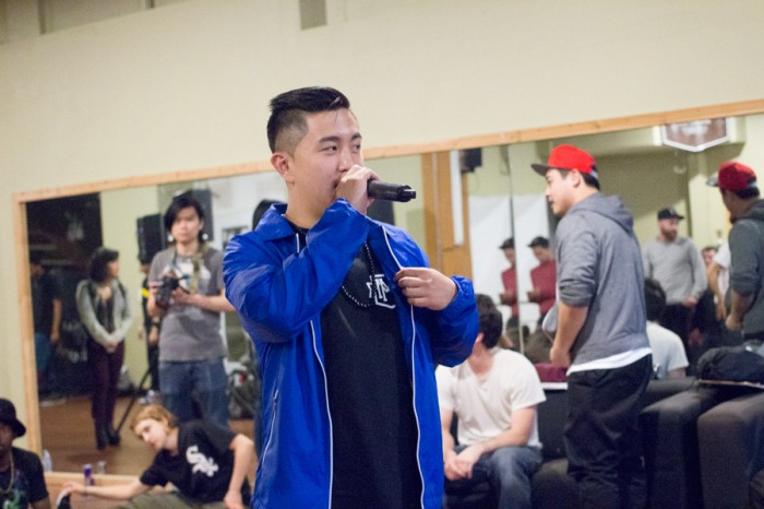 Local B-Boy event organizer Michael Huang gets the crowd pumped for the next match-up. (Photo by Austin Williams)