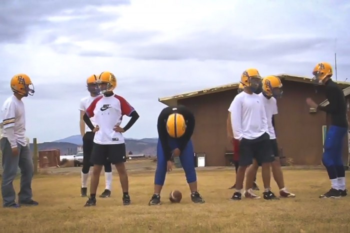Exchange students try their hands at American football (with mixed results) in a still from "Welcome to Unity"