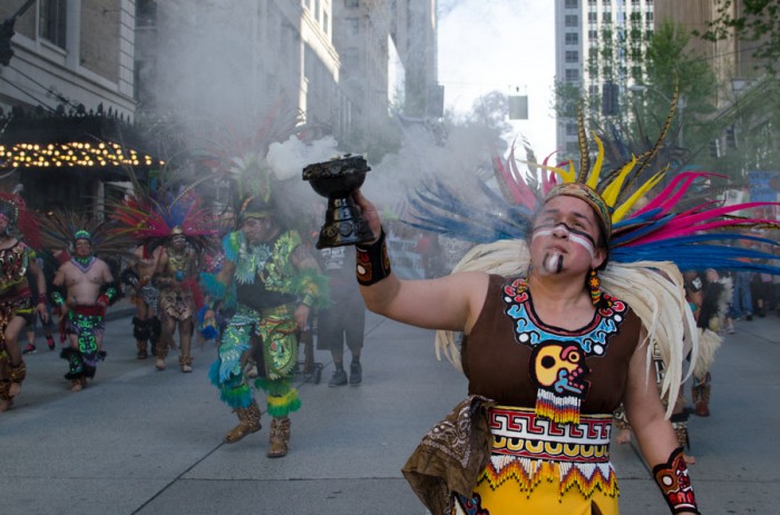 A group of Aztec dancers from Danza Ce Atl Tonalli led the march in colorful costumes burning incense. (Photo by Seth Halleran)
